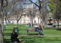 People sitting in a park in downtown San Jose