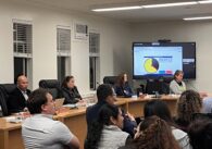 East San Jose school board members sit inside at a public meeting
