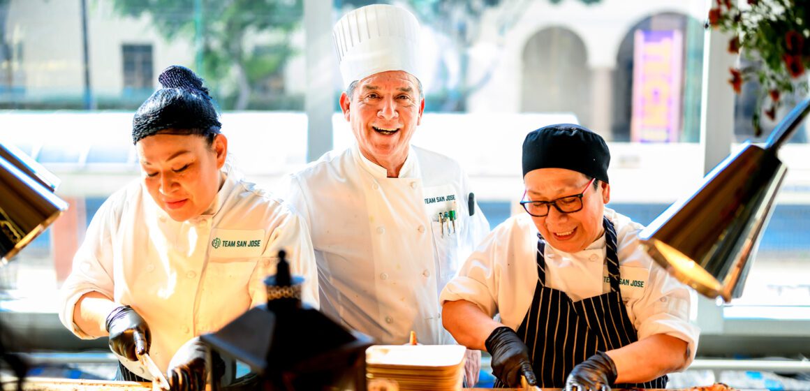 Three chefs prep food at a restaurant in San Jose