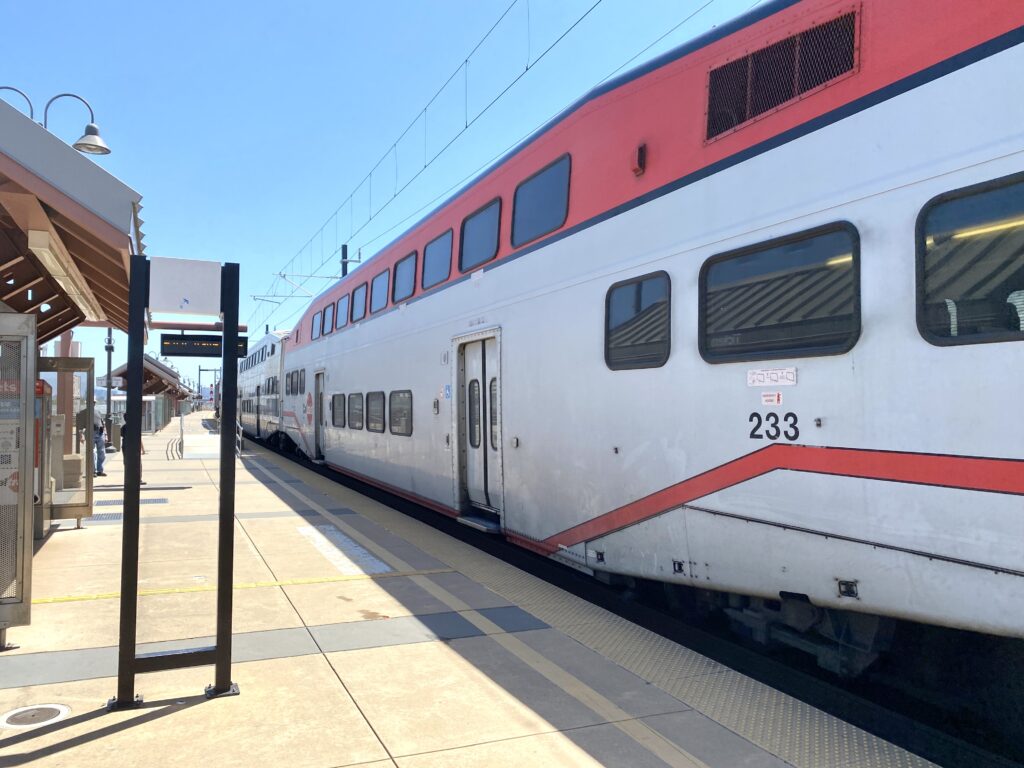 CalTrain two-floor passenger train at empty train platform