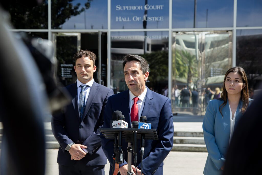 Santa Clara County District Attorney Jeff Rosen speaks outside at a podium
