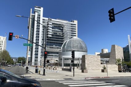 San Jose City Hall rotunda and building behind Fourth Street intersection lights