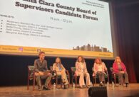 Five people on a stage during an election candidate forum