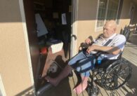 Man in wheelchair in motel