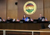 Santa Clara City Council chambers, centered on a Caucasian brunette woman in a blue blazer with the name tag "Mayor, Lisa M. Gillmor"