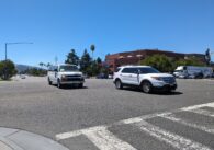 A busy intersection in Cupertino with cars coming down the street