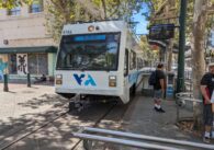 A light rail train running through downtown San Jose