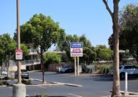 Parking lot around sign for Lakewood Shopping Center