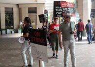 Hotel workers with picket signs.