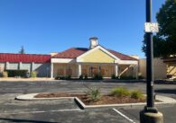 A closed retail center and parking lot