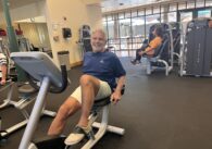 People on exercise equipment at a gym