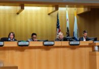 People sitting at a meeting.