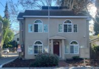 A two-story house on a quiet street