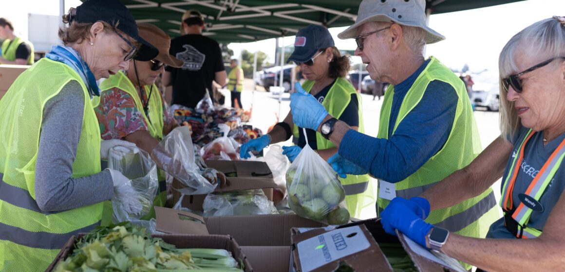 People distributing food for donations