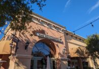 The exterior of a restaurant with a sign that reads "The Grillhouse"
