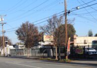Buildings and fences along a street