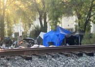 A homeless camp near railroad tracks