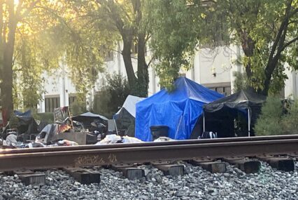 A homeless camp near railroad tracks
