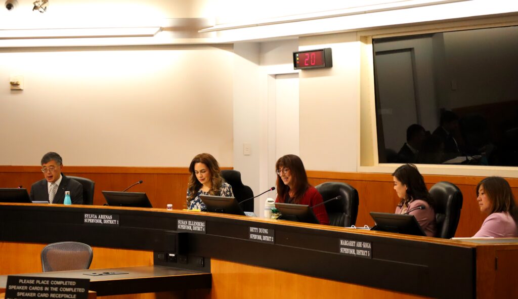 Santa Clara County Board Chambers with five supervisors seated, in order from left to right: Otto Lee, Sylvia Arenas, Susan Ellenberg, Betty Duong, Margaret Abe-Koga