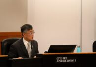 Otto Lee, District 3 Supervisor, speaking from board dias. Man with square glasses and short black-grey hair wearing a suit with a striped tie.