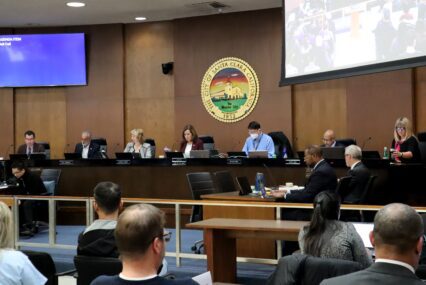 Santa Clara City Council seated at dias with city crest behind