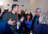A man speaks to a crowd of people
