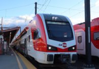 An electric train waiting at a station