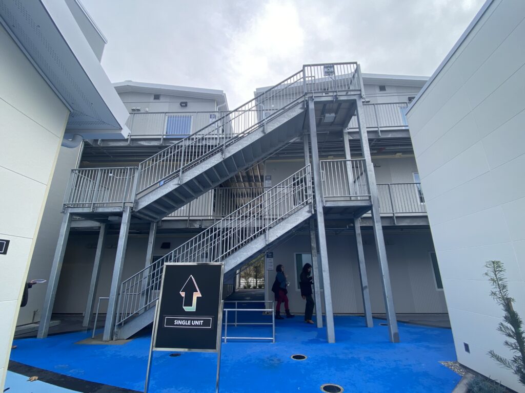 Stairs leading up to the higher levels of a modular housing site for homeless people in San Jose, California