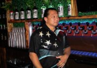 A man standing inside a music venue