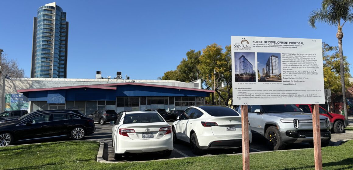 Gateway Tower A parking lot with a development project sign in the foreground