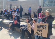 People standing with protest signs