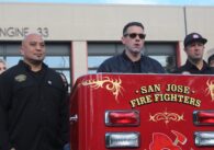San Jose Fire Fighters Local 230 president Jerry May (center) wearing sunglasses and standing in front of the shuttered Station 33 in San Jose on April 2 surrounded by union-represented city workers.