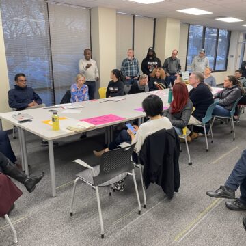 A group of people sitting around a table