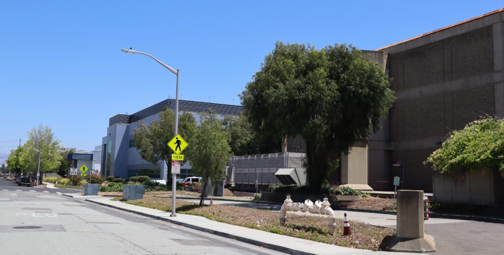 Multiple unmarked buildings along the same street