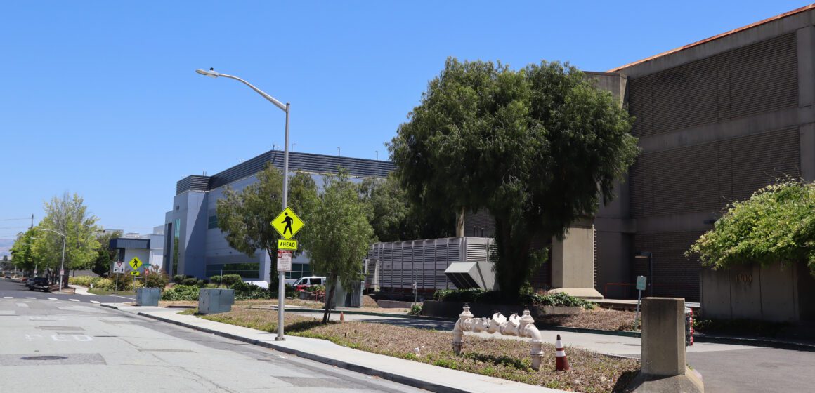 Multiple unmarked buildings along the same street