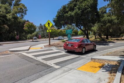 A red sedan drives onto the Highway 17 North entrance in Los Gatos
