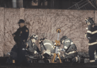 First responders provide care to a patient on the ground