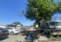 An RV and cars parked at a park in San Jose