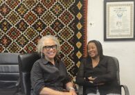 Two women sitting in chairs