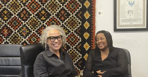 Two women sitting in chairs