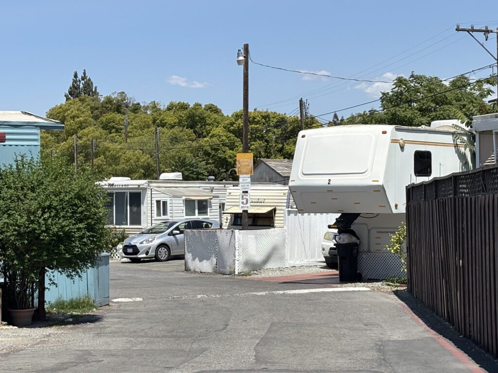 A view of a trailer park on a sunny, blue sky day.