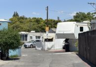 A view of a trailer park on a sunny, blue sky day.