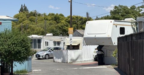 A view of a trailer park on a sunny, blue sky day.