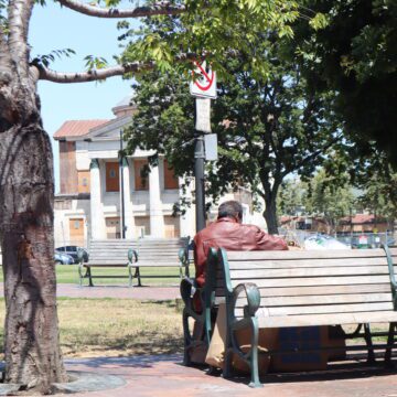 ST. JAMES A homeless person sits on a park bench in San Jose, California
