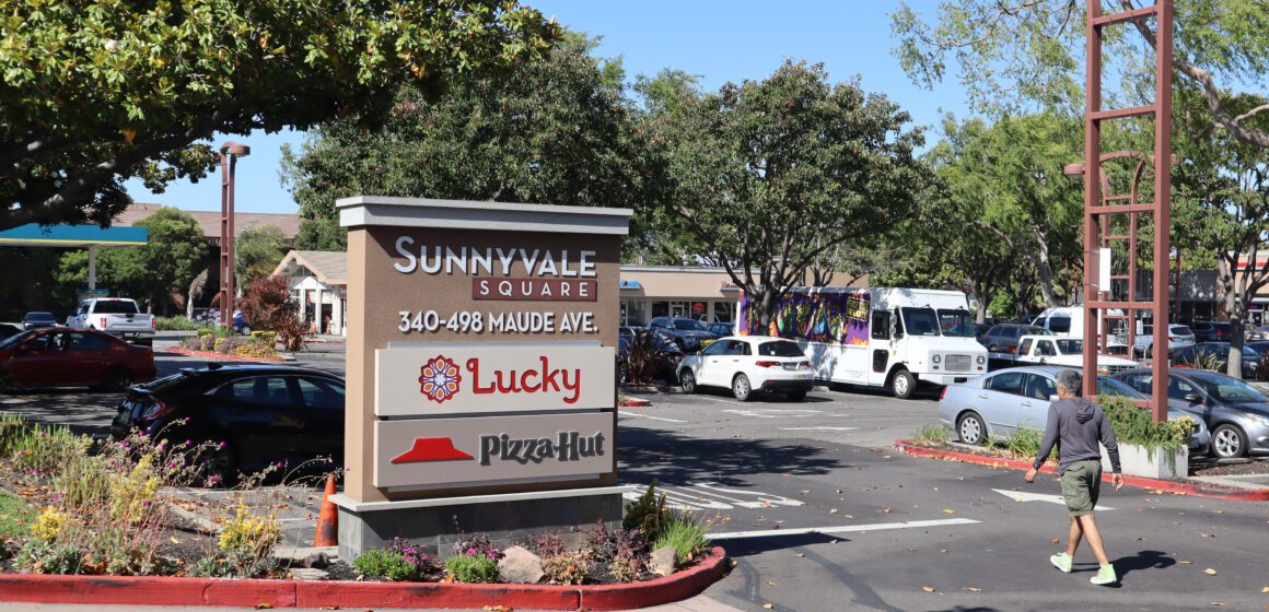 Photo of a parking lot and sign showing the address of Sunnyvale Square, 340-498 Maude Ave, where there's a Lucky Supermarket and Pizza Hut