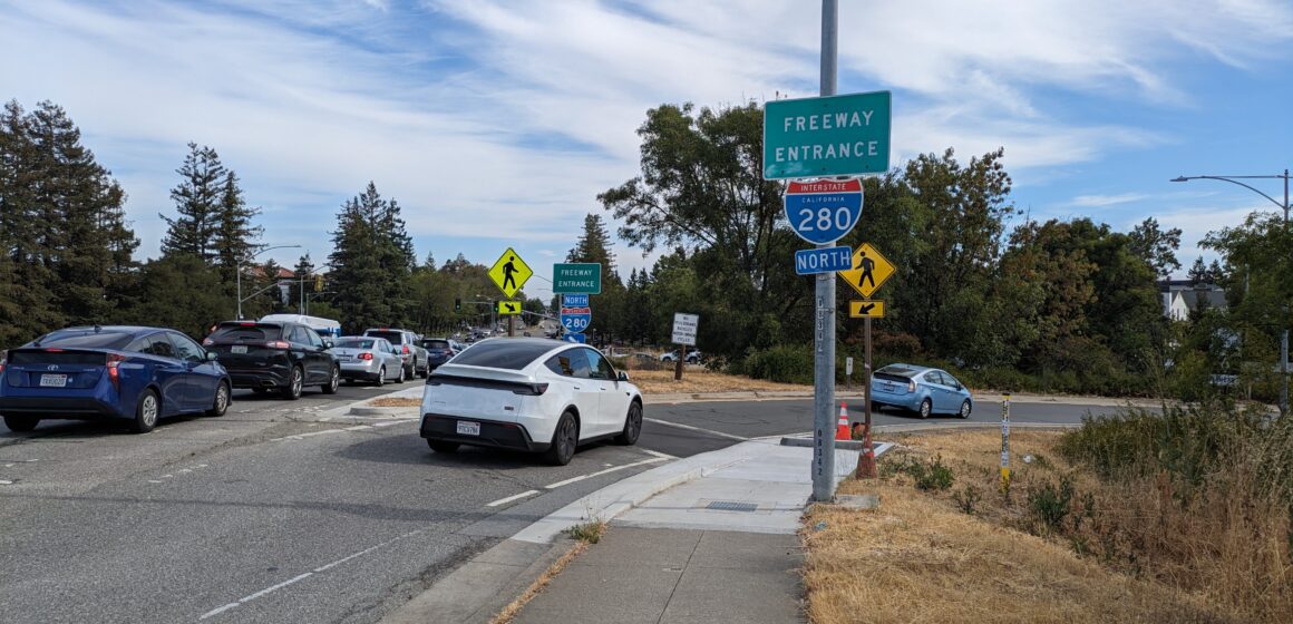 Cars enter an interstate on-ramp