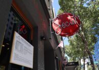 A neon sign above a nightclub in downtown San Jose