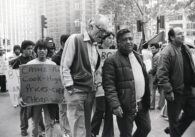 People walking in a protest march in a historic black and white photo