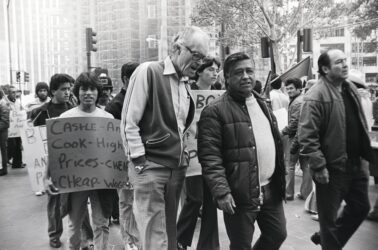 People walking in a protest march in a historic black and white photo