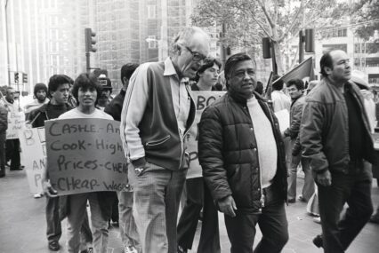 People walking in a protest march in a historic black and white photo